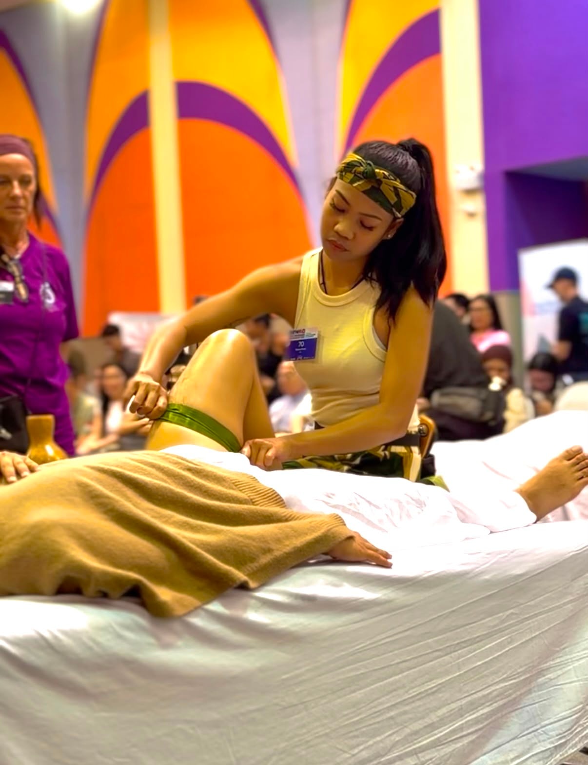 Competitor performing massage at international championship